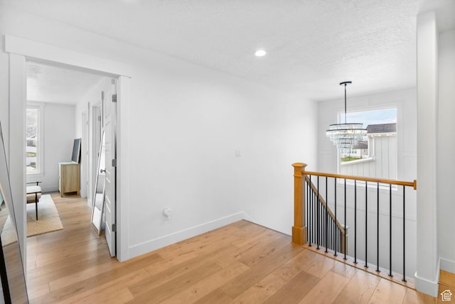 2862 S Preening Way, Saratoga Springs, UT 84045 - corridor featuring recessed lighting, an upstairs landing, baseboards, light wood-type flooring, and a textured ceiling