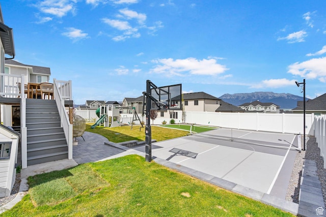 2862 S Preening Way, Saratoga Springs, UT 84045 - view of sport court with a residential view, a playground, a mountain view, fence, and a yard