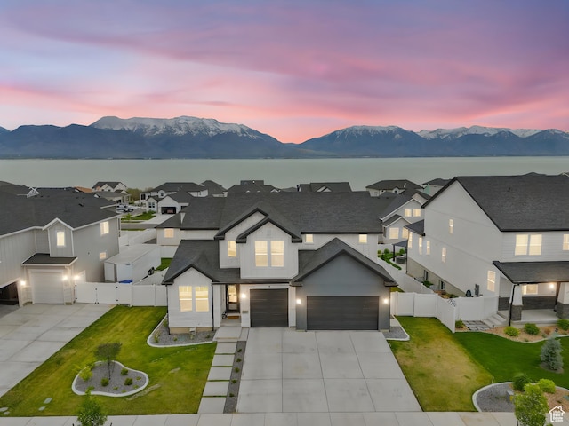 2862 S Preening Way, Saratoga Springs, UT 84045 - traditional home with a garage, a yard, a mountain view, driveway, and fence