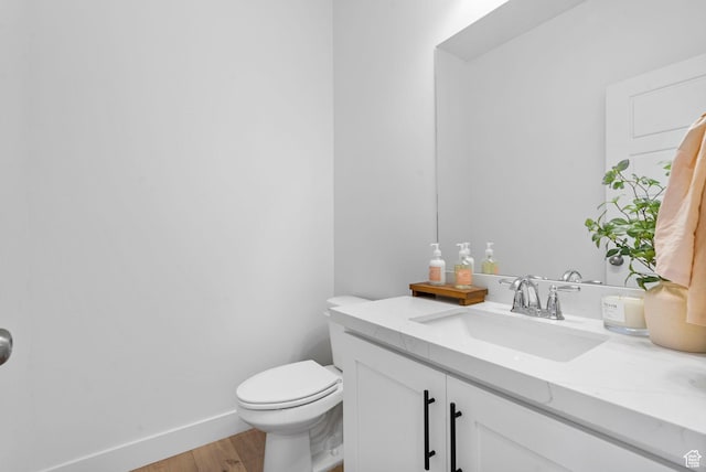 2862 S Preening Way, Saratoga Springs, UT 84045 - bathroom featuring toilet, wood finished floors, vanity, and baseboards