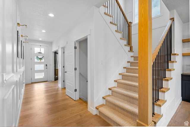 2862 S Preening Way, Saratoga Springs, UT 84045 - stairs with hardwood / wood-style floors, recessed lighting, and baseboards