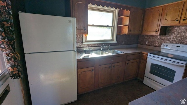 252 N Highland Dr, Cedar City, UT 84721 - kitchen with brown cabinets, a sink, white appliances, backsplash, and light countertops