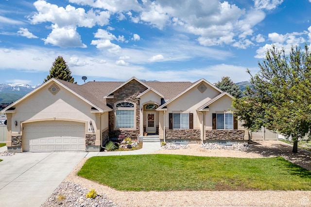 676 S 620 E, Heber City, UT 84032 - view of front of property with stucco siding, stone siding, an attached garage, driveway, and a mountain view