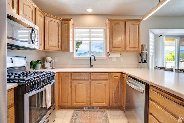 676 S 620 E, Heber City, UT 84032 - kitchen featuring appliances with stainless steel finishes, a sink, light brown cabinets, light countertops, and recessed lighting