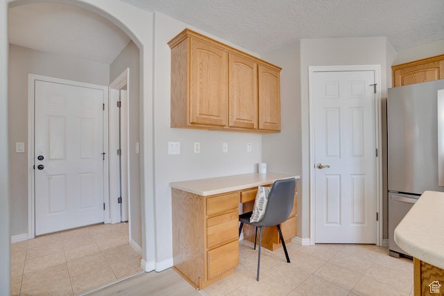 676 S 620 E, Heber City, UT 84032 - home office with built in desk, arched walkways, light tile patterned floors, and baseboards