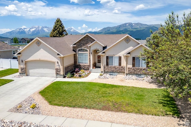 676 S 620 E, Heber City, UT 84032 - view of front of house with stone siding, stucco siding, a mountain view, and a garage