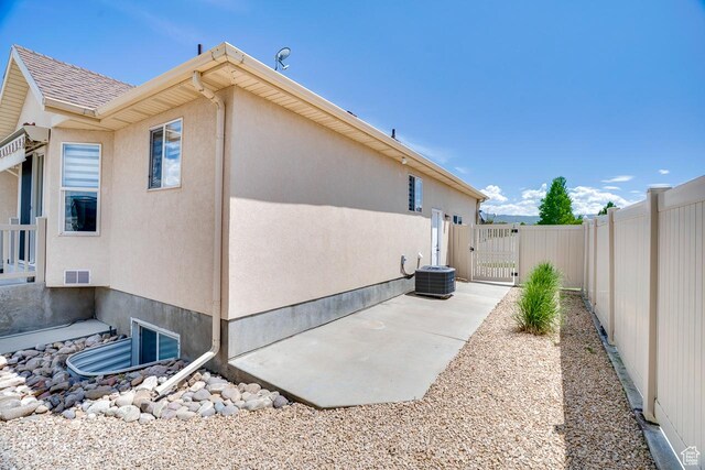 676 S 620 E, Heber City, UT 84032 - view of side of property featuring a gate, stucco siding, central air condition unit, and a patio area