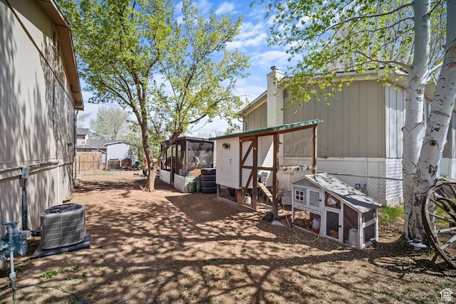 537 E 650 N, Roosevelt, UT 84066 - exterior space with exterior structure, an outbuilding, a fenced backyard, cooling unit, and a chimney