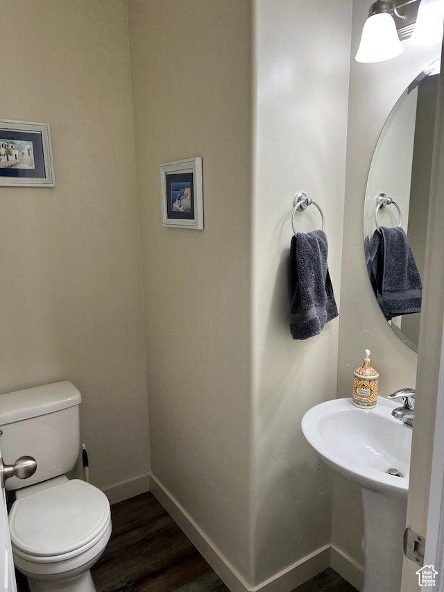 272 W 680 N, Centerville, UT 84014 - half bathroom with baseboards, wood finished floors, toilet, and a sink