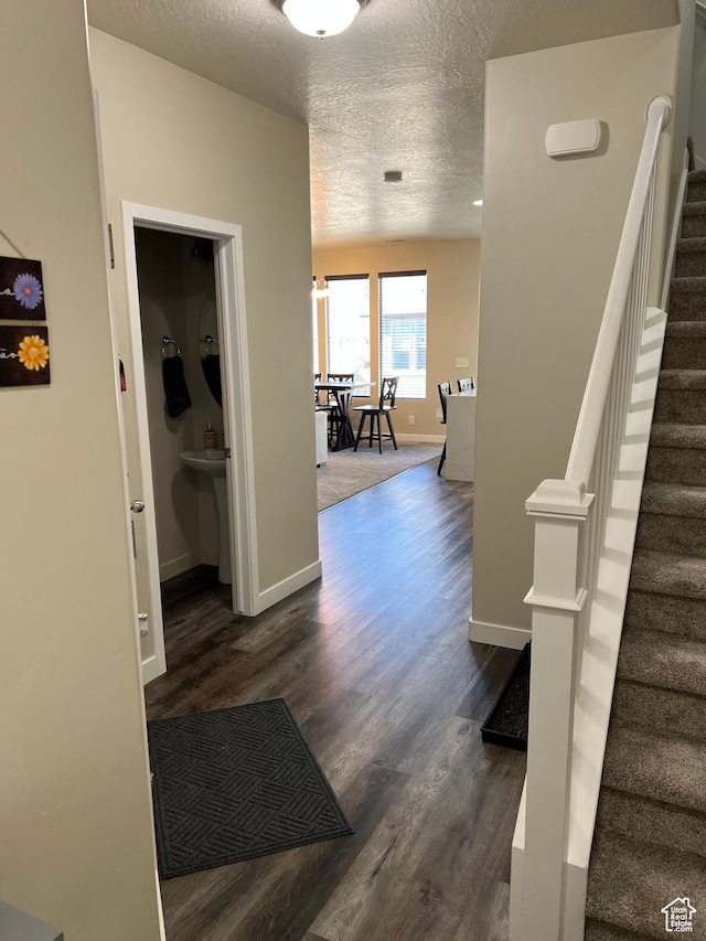 272 W 680 N, Centerville, UT 84014 - corridor with dark wood finished floors, baseboards, stairs, and a textured ceiling