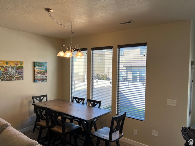 272 W 680 N, Centerville, UT 84014 - carpeted dining room featuring a notable chandelier, plenty of natural light, visible vents, and baseboards