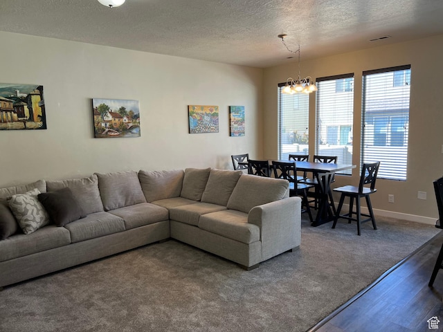 272 W 680 N, Centerville, UT 84014 - living area with wood finished floors, a textured ceiling, a wealth of natural light, and a chandelier