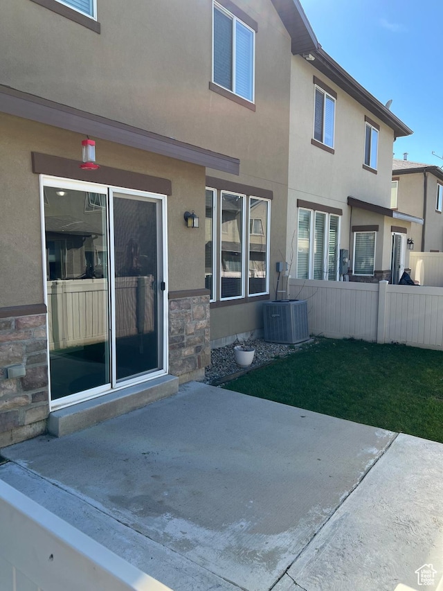 272 W 680 N, Centerville, UT 84014 - rear view of property with a patio, fence, stucco siding, and stone siding