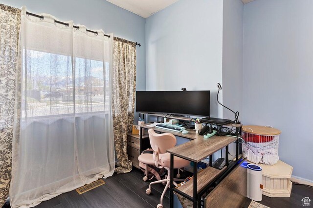 office with dark wood-type flooring
