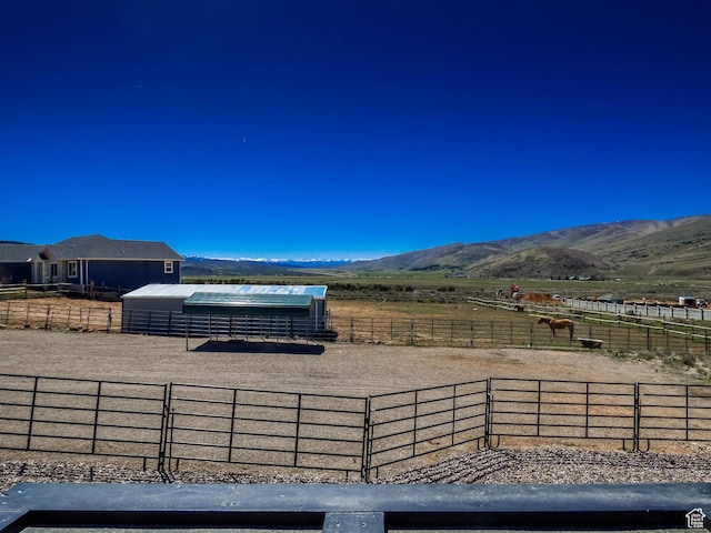 4718 E Cougar Run S, Ut, UT 84629 - view of patio / terrace with an outbuilding, a mountain view, an enclosed area, and an exterior structure