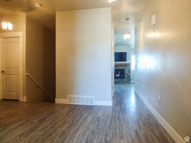 4718 E Cougar Run S, Ut, UT 84629 - interior space featuring a stone fireplace, visible vents, dark wood finished floors, and baseboards