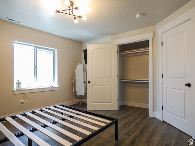 4718 E Cougar Run S, Ut, UT 84629 - unfurnished bedroom featuring visible vents, baseboards, a closet, dark wood-style flooring, and a notable chandelier