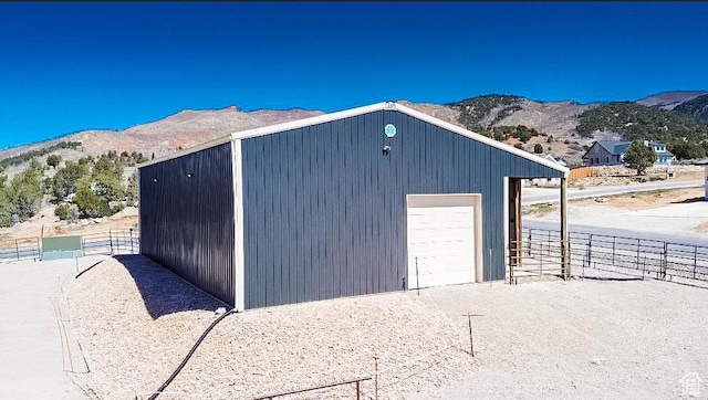 4718 E Cougar Run S, Ut, UT 84629 - detached garage featuring a mountain view and fence