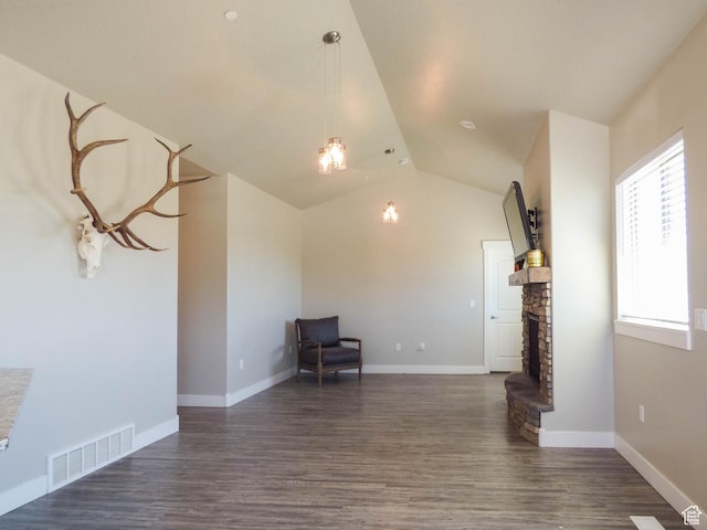 4718 E Cougar Run S, Ut, UT 84629 - unfurnished room with visible vents, dark wood-style flooring, lofted ceiling, and a fireplace