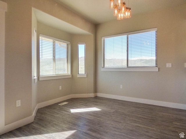 4718 E Cougar Run S, Ut, UT 84629 - empty room featuring visible vents, an inviting chandelier, wood finished floors, and baseboards