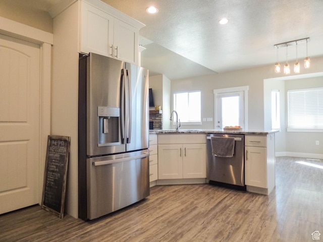 4718 E Cougar Run S, Ut, UT 84629 - kitchen featuring wood finished floors, a sink, white cabinetry, and stainless steel appliances