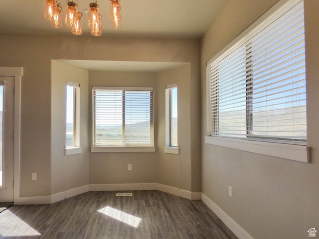 4718 E Cougar Run S, Ut, UT 84629 - unfurnished room featuring visible vents, wood finished floors, a notable chandelier, and baseboards