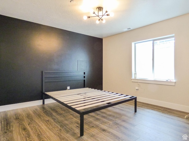 4718 E Cougar Run S, Ut, UT 84629 - bedroom with visible vents, wood finished floors, a chandelier, and baseboards