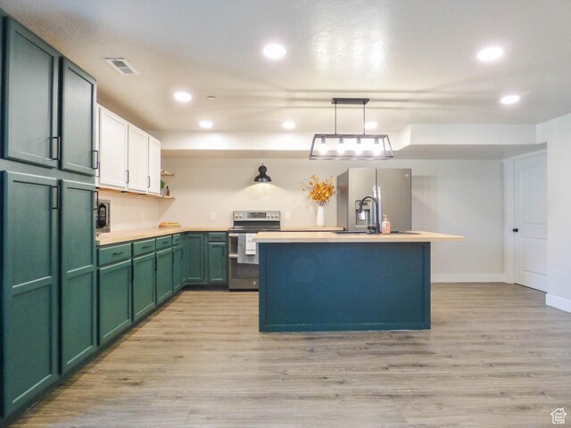 4718 E Cougar Run S, Ut, UT 84629 - kitchen featuring open shelves, light wood-style flooring, stainless steel appliances, light countertops, and green cabinets