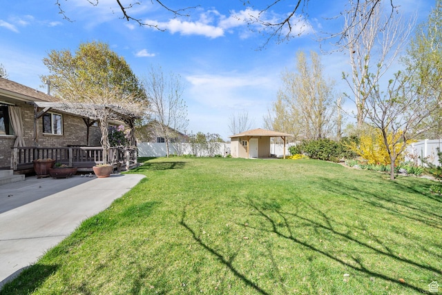 428 N 100 W, Santaquin, UT 84655 - view of yard with a pergola, an outdoor structure, a storage shed, a deck, and fence