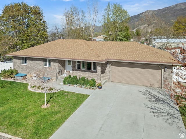 428 N 100 W, Santaquin, UT 84655 - ranch-style home featuring driveway, a shingled roof, a mountain view, an attached garage, and a front lawn