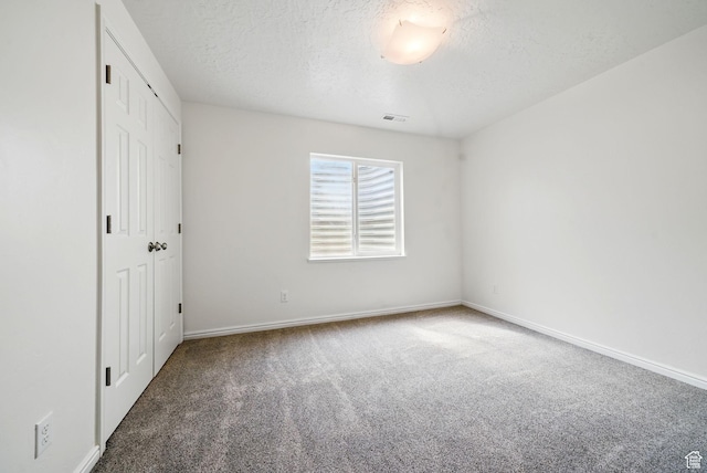 428 N 100 W, Santaquin, UT 84655 - unfurnished bedroom with carpet flooring, a closet, visible vents, baseboards, and a textured ceiling