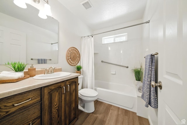 428 N 100 W, Santaquin, UT 84655 - bathroom with visible vents, toilet, shower / bath combination with curtain, wood finished floors, and vanity
