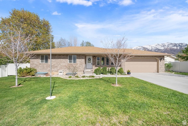 428 N 100 W, Santaquin, UT 84655 - ranch-style home with driveway, an attached garage, fence, brick siding, and a front lawn