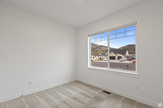 1169 N 200 E, Nephi, UT 84648 - carpeted spare room featuring a mountain view, visible vents, and baseboards