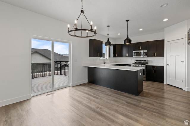 1169 N 200 E, Nephi, UT 84648 - kitchen with a chandelier, baseboards, stainless steel appliances, and recessed lighting