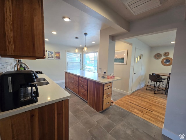 5841 S 129 W, Murray, UT 84107 - kitchen featuring a sink, decorative light fixtures, recessed lighting, light countertops, and baseboards