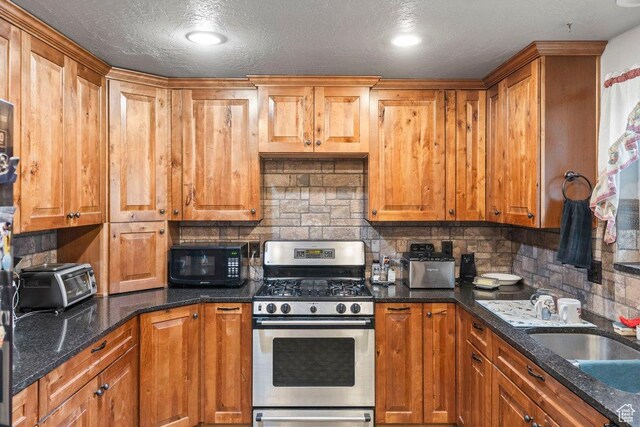 3168 W 1300 N, Clinton, UT 84015 - kitchen with a sink, black microwave, backsplash, a toaster, and stainless steel gas range oven