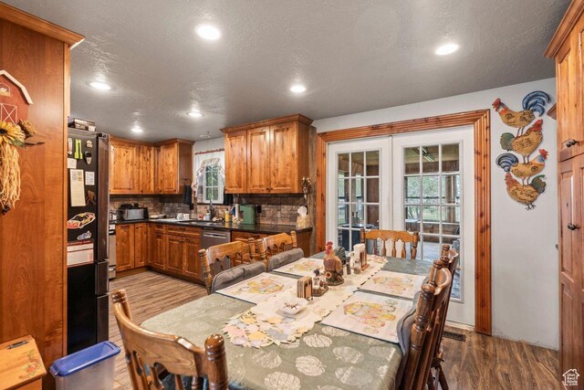 3168 W 1300 N, Clinton, UT 84015 - kitchen with recessed lighting, brown cabinets, wood finished floors, and french doors