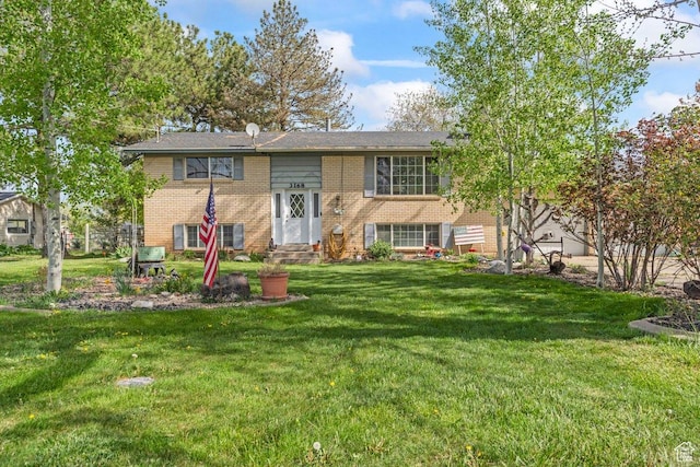 3168 W 1300 N, Clinton, UT 84015 - rear view of property with a lawn, entry steps, and brick siding
