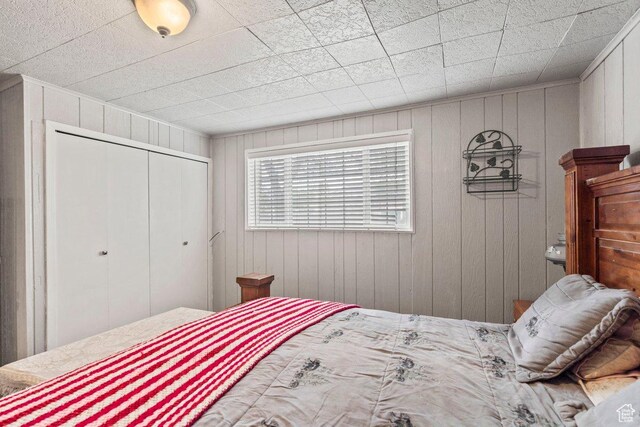 3168 W 1300 N, Clinton, UT 84015 - bedroom with wooden walls and a closet