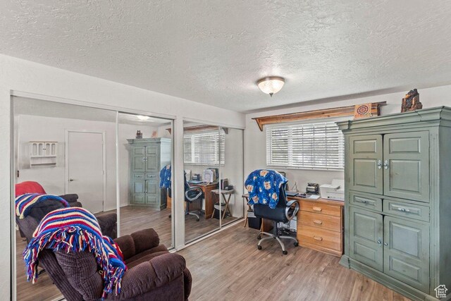 3168 W 1300 N, Clinton, UT 84015 - office area featuring light wood finished floors and a textured ceiling