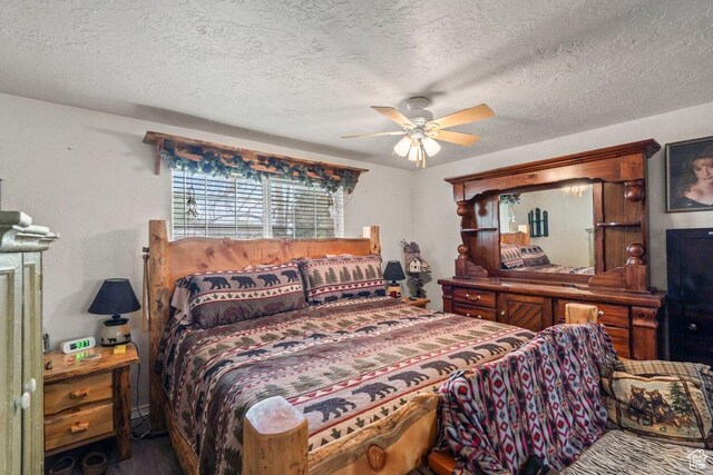 3168 W 1300 N, Clinton, UT 84015 - bedroom with a textured ceiling, a ceiling fan, and wood finished floors