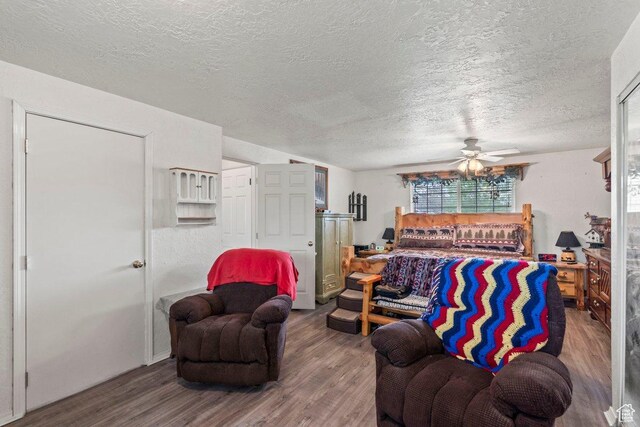 3168 W 1300 N, Clinton, UT 84015 - living room with a textured ceiling, wood finished floors, and ceiling fan