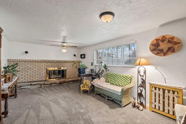3168 W 1300 N, Clinton, UT 84015 - carpeted living area featuring a fireplace, a textured ceiling, ceiling fan, and baseboards