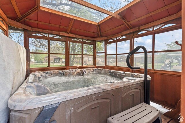 3168 W 1300 N, Clinton, UT 84015 - sunroom featuring a wealth of natural light, a hot tub, and a skylight