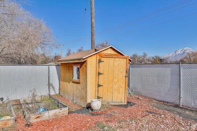 4222 S 1100 E, Millcreek, UT 84124 - view of shed featuring a vegetable garden and a fenced backyard
