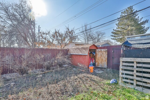 4222 S 1100 E, Millcreek, UT 84124 - view of yard with an outbuilding, a shed, a fenced backyard, and a gate