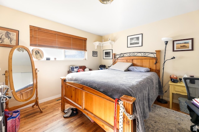 4222 S 1100 E, Millcreek, UT 84124 - bedroom with baseboards and light wood-type flooring