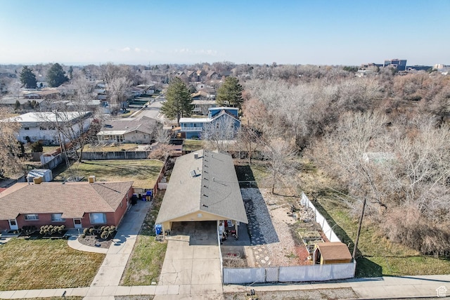 birds eye view of property with a residential view