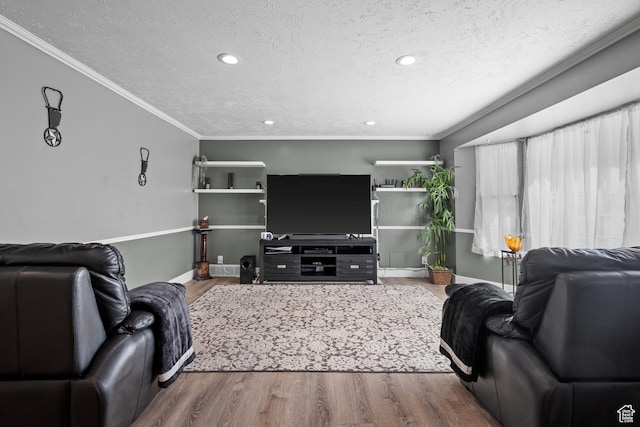 living room with ornamental molding, recessed lighting, a textured ceiling, and wood finished floors